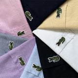 Flat lay presentation of Lacoste luxury clothing with logo-detail design