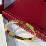 Side view of Cartier unisex jewelry piece
