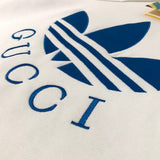 Back view of Gucci luxury clothing with label-forward styling