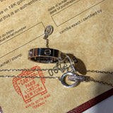 Front view of Cartier unisex jewelry piece