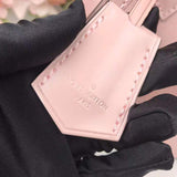 Handle and strap detail of chic everyday-luxe women's handbag – women's designer-style accessory