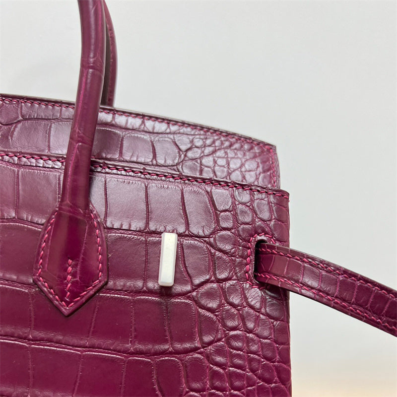 Side view of streamlined structured handbag