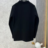 Side profile of Louis Vuitton luxury clothing with label-forward styling