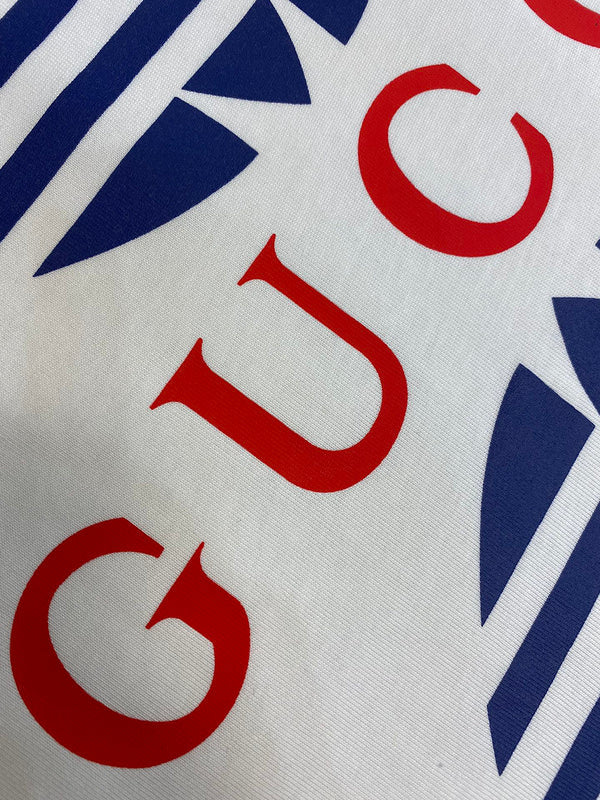 Back view of Gucci luxury clothing with signature branding