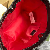 Side profile of statement modern women's handbag – women's luxury handbag