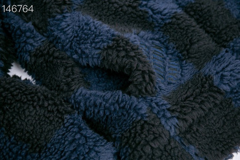 Flat lay presentation of Louis Vuitton luxury clothing with relaxed-fit cut