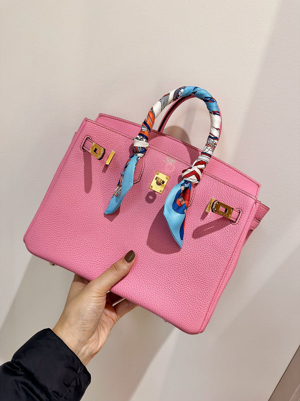 Side view of streamlined structured handbag