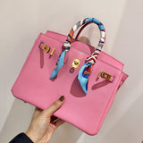 Side view of streamlined structured handbag