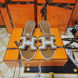 Hermès White Slide Sandals - Angled View