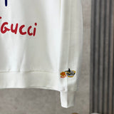 Flat lay presentation of Gucci luxury clothing with runway-inspired design