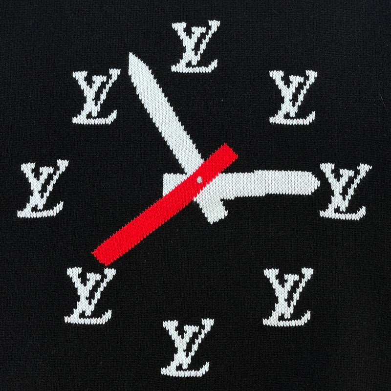 Flat lay presentation of Louis Vuitton luxury clothing with label-forward styling