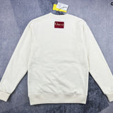 Side profile of Gucci luxury clothing with signature branding