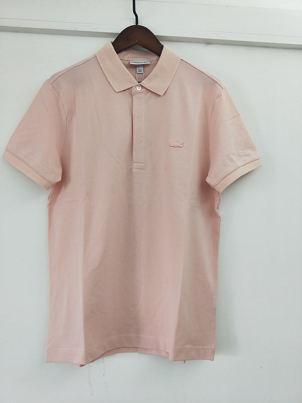 Side profile of Lacoste luxury clothing with signature branding