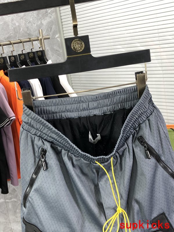 Side profile of Rhude luxury clothing with monogram-inspired silhouette