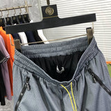 Side profile of Rhude luxury clothing with monogram-inspired silhouette