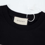 Close-up detail shot of Gucci luxury clothing with everyday silhouette