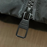 Close-up detail shot of Louis Vuitton luxury clothing with logo-detail design
