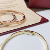 Side view of Cartier unisex jewelry piece