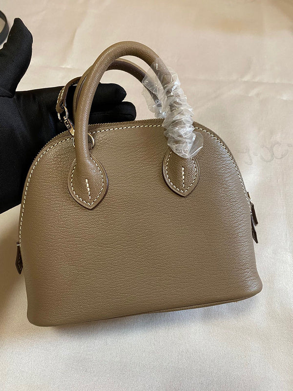 Side view of minimalist structured handbag