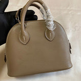 Side view of minimalist structured handbag