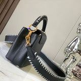 Close-up detail of polished structured women's handbag – women's luxury accessory