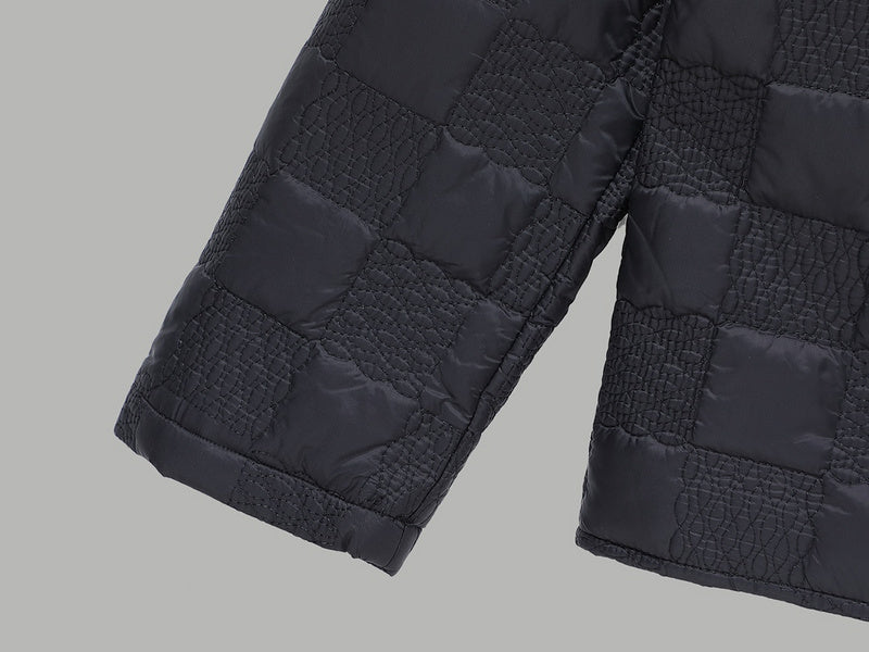 Flat lay presentation of Louis Vuitton luxury clothing with monogram-inspired silhouette
