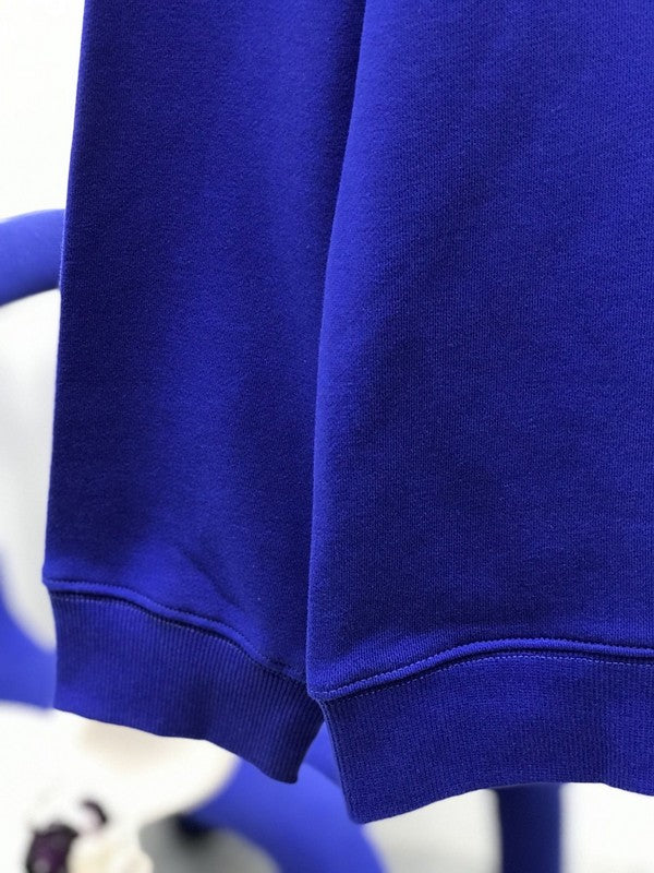 Close-up detail shot of Louis Vuitton luxury clothing with runway-inspired design