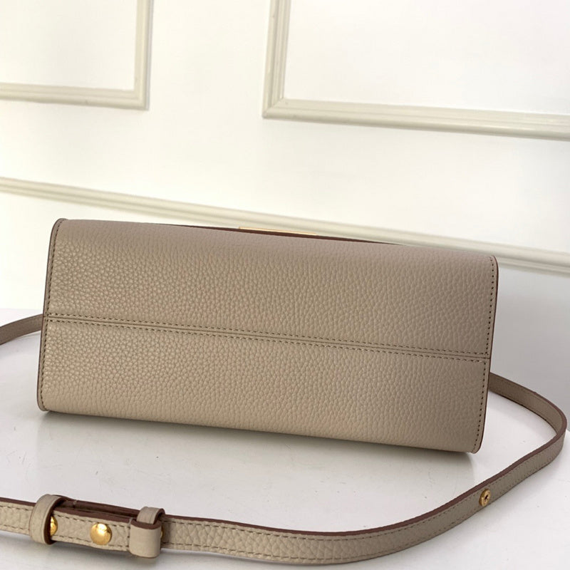 Styled lifestyle shot of statement everyday-luxe women's handbag – women's designer-style accessory