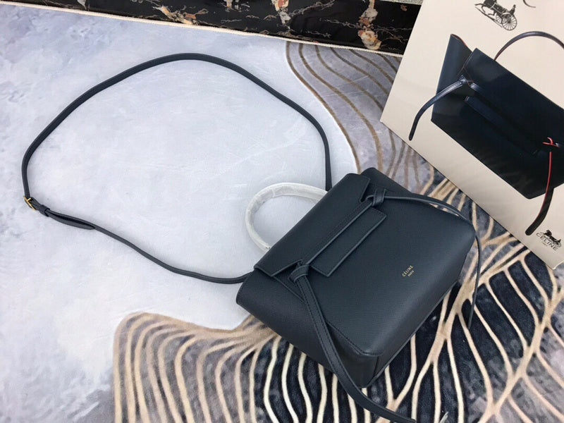 Side profile of polished signature women's handbag – women's luxury accessory