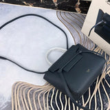 Side profile of polished signature women's handbag – women's luxury accessory