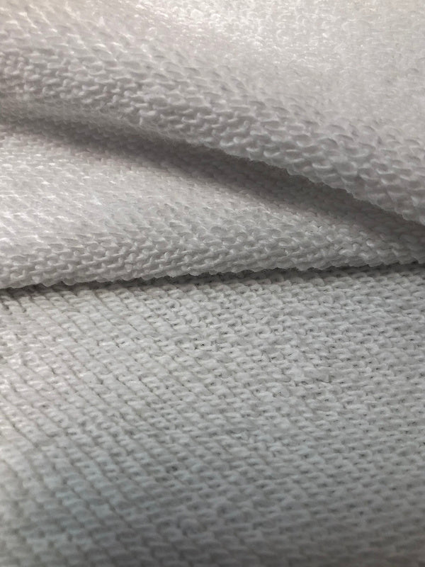 Close-up detail shot of Gucci luxury clothing with label-forward styling