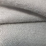 Close-up detail shot of Gucci luxury clothing with label-forward styling