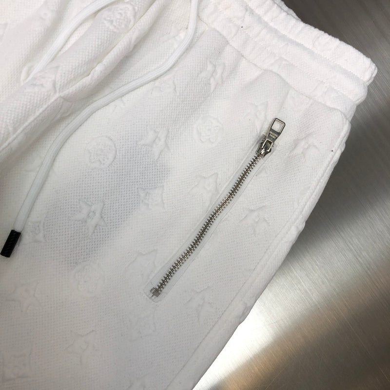 Full styled look of Louis Vuitton luxury clothing with monogram-inspired silhouette