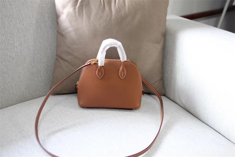 Side view of clean-lined structured handbag