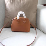Side view of clean-lined structured handbag