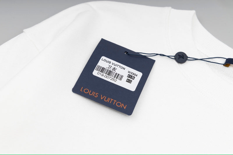 Flat lay presentation of Louis Vuitton luxury clothing with everyday silhouette