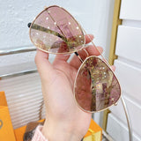 Lifestyle view of Louis Vuitton unisex sunglasses