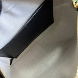 Side profile of statement sleek women's handbag – women's luxury accessory