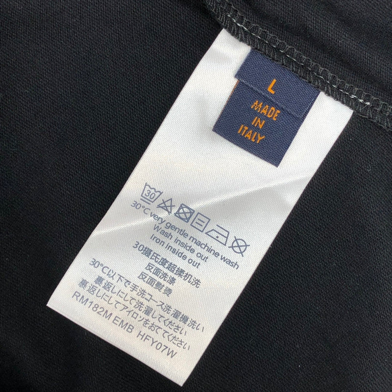 Flat lay presentation of Louis Vuitton cotton t-shirt with logo-detail design