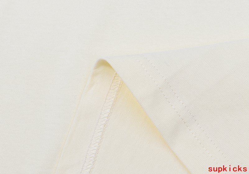 Close-up detail shot of Rhude luxury clothing with signature branding