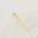 Close-up detail shot of Rhude luxury clothing with signature branding
