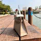 Polished bag shown from front angle
