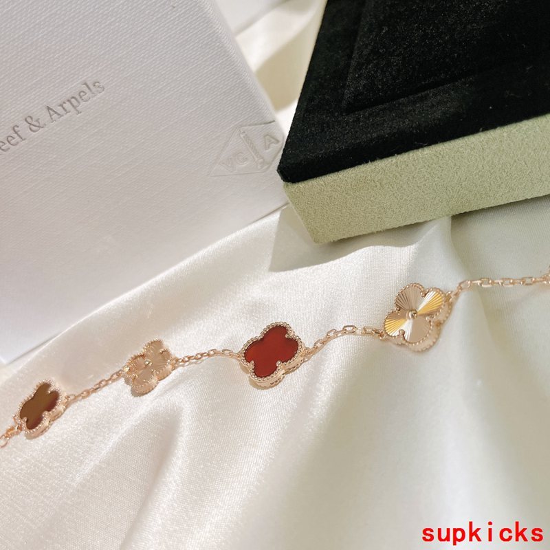 Lifestyle view of Van Cleef & Arpels unisex jewelry piece