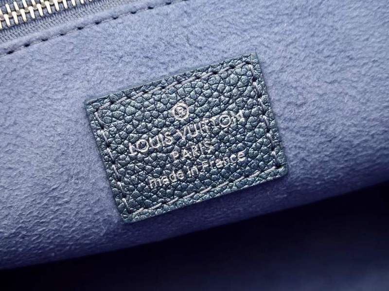 Side profile of refined structured women's handbag – women's statement bag
