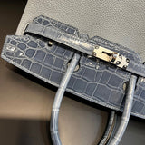 Side view of fluid structured handbag