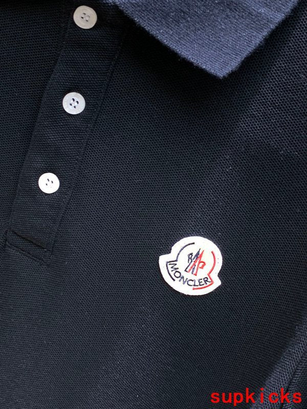 Front view of Moncler luxury clothing with signature branding
