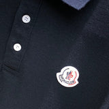 Front view of Moncler luxury clothing with signature branding