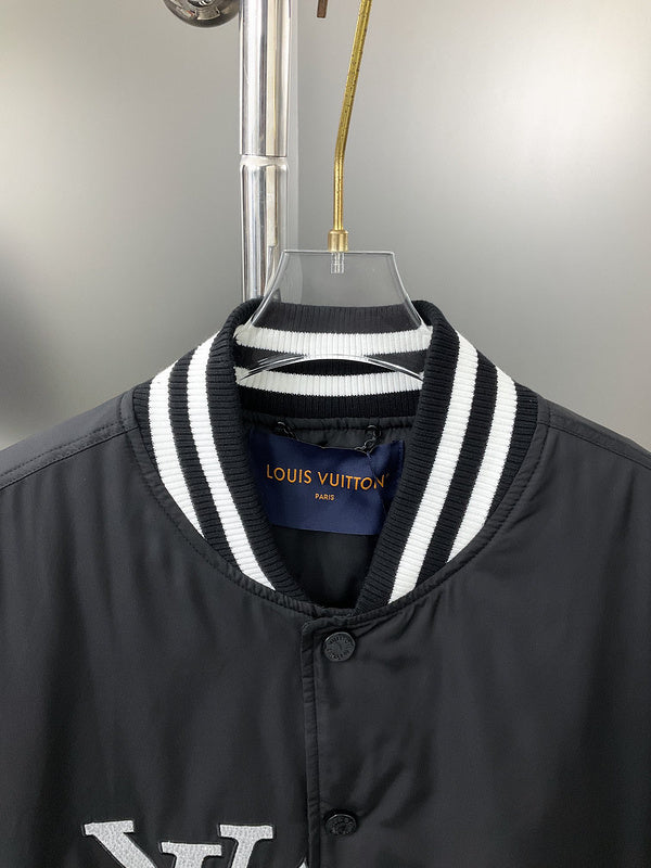 Close-up detail shot of Louis Vuitton luxury clothing with label-forward styling