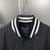 Close-up detail shot of Louis Vuitton luxury clothing with label-forward styling