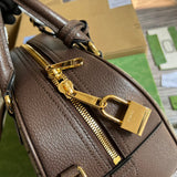 Side view of polished structured handbag